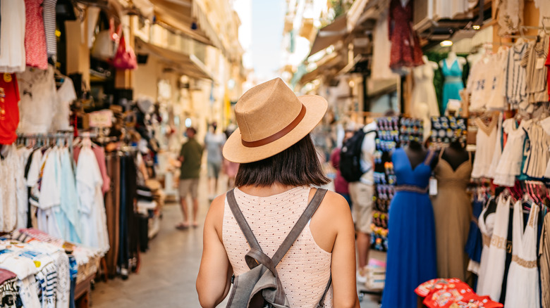 tourist shopping at street marker