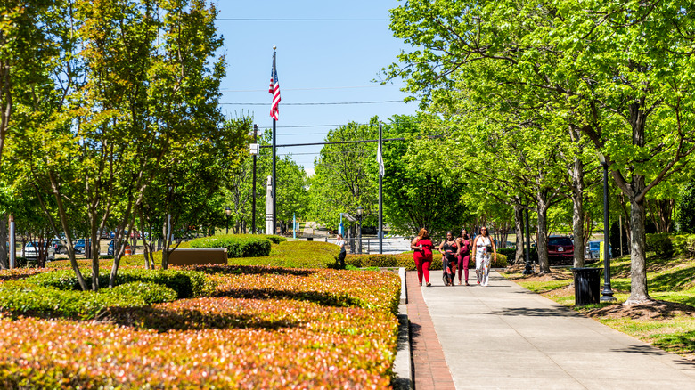 Friends walking through an urban park