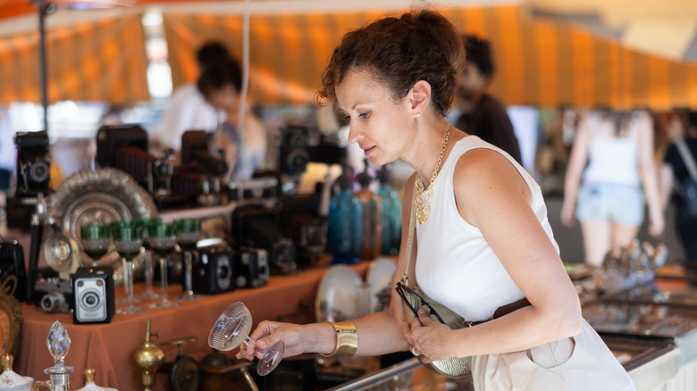 A woman browses antiques
