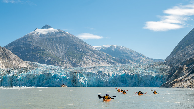 kayakers near glacier