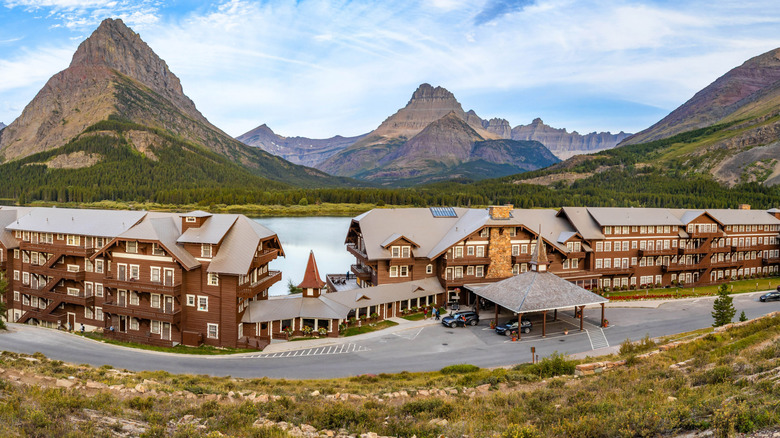 Many Glacier Hotel on the edge of Swiftcurrent Lake, with Grinnell Point in the background in Glacier National Park in Montana