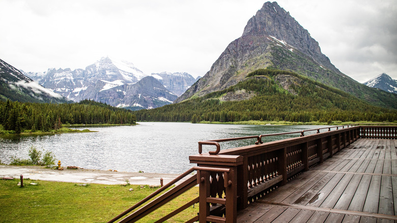 the view of Swiftcurrent Lake and Grinnell Glacier from the deck of Many Glacier Hotel in Glacier National Park, Montana