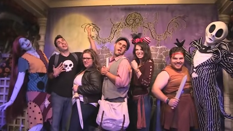 Disney guests posing with Jack Skellington and Sally
