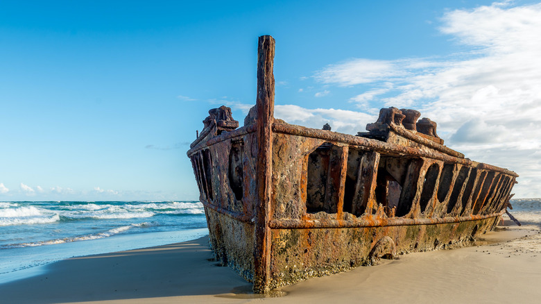 rusted shipwreck on beach