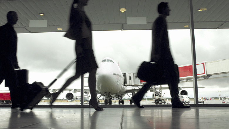 People walking in busy airport