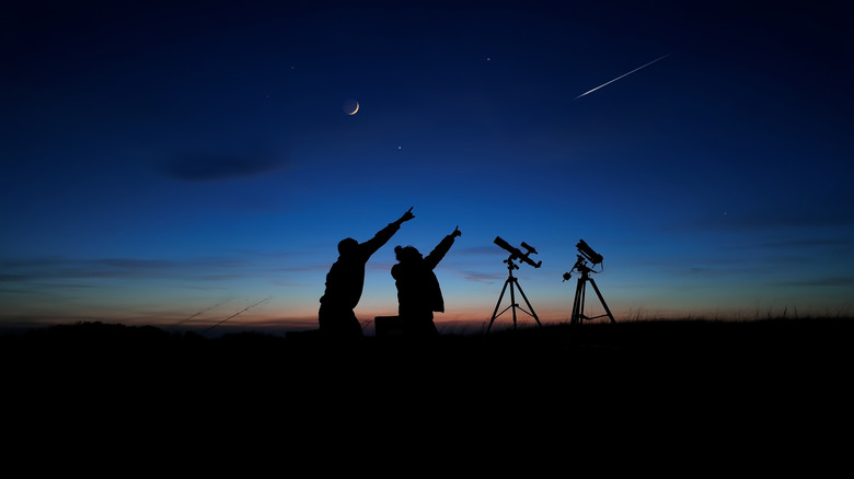stargazers with telescope