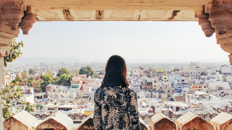 Woman overlooking town