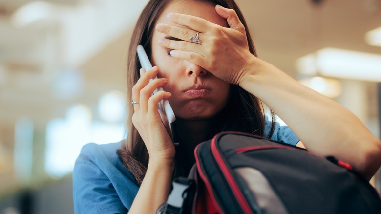 woman unhappy at airport