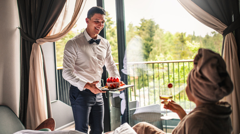person receiving room service