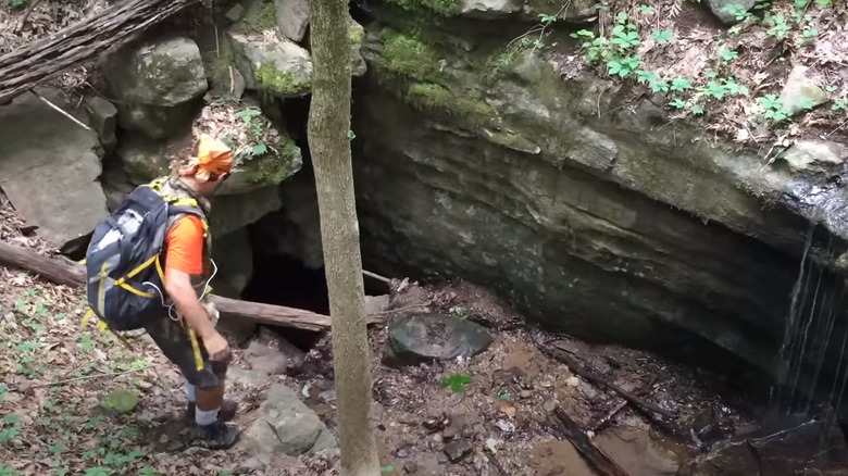 Caver at entrance to Ellison's Cave