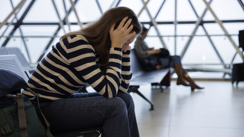 A frustrated traveler in an airport