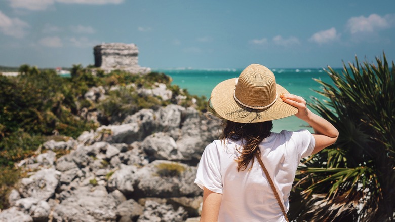 woman with hat in tulum