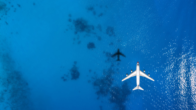 plane flying over the ocean