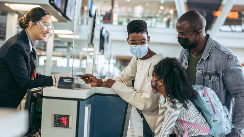 Family at airport check in