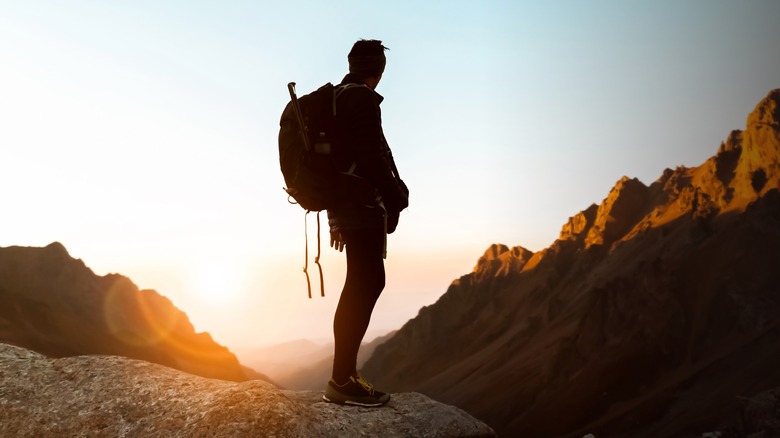Backpacker's silhouette in the desert