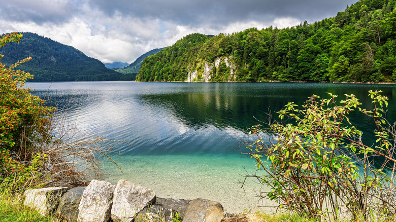 Alpsee, a pretty glacial lake, in the village of Hohenschwangau in Bavaria, Germany