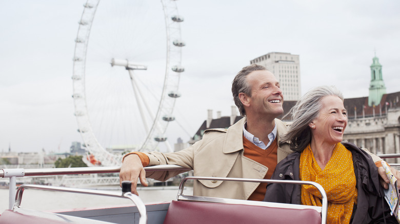 Traveling couple sitting on a boat