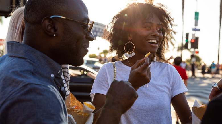 people eating fries from foodtruck