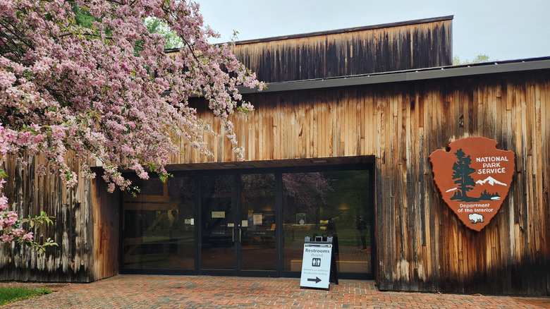 park visitor center entrance with cherry blossom