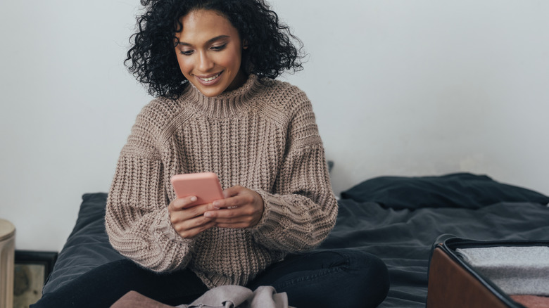 person booking flights on tablet