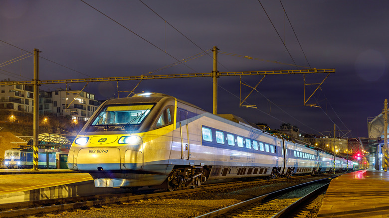 Train departs at night in Czechia