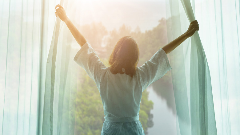 Woman looking out of window