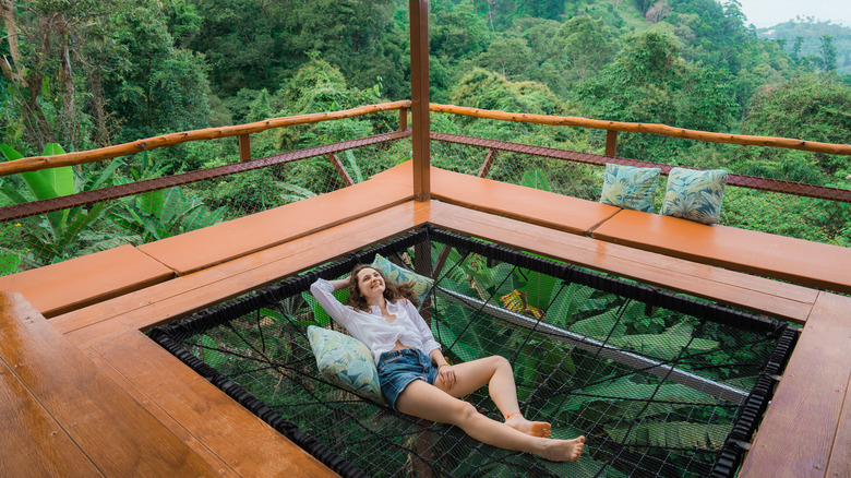 Woman enjoying hammock at Airbnb