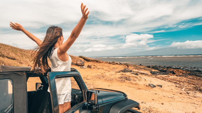 Happy woman on road trip