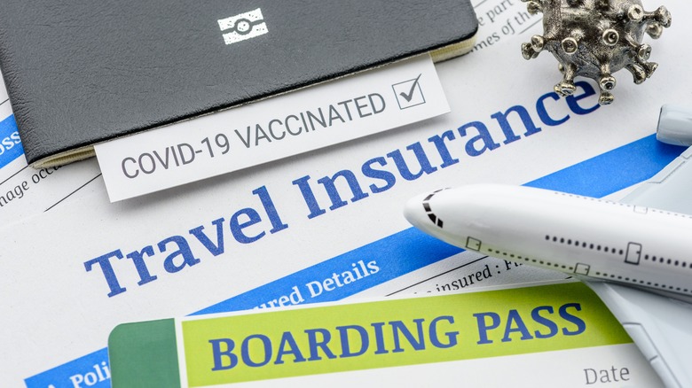 Passport, boarding pass, and travel insurance