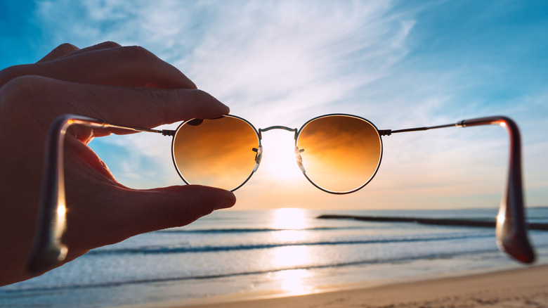 sunglasses on sandy beach
