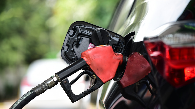 Person pumping gas