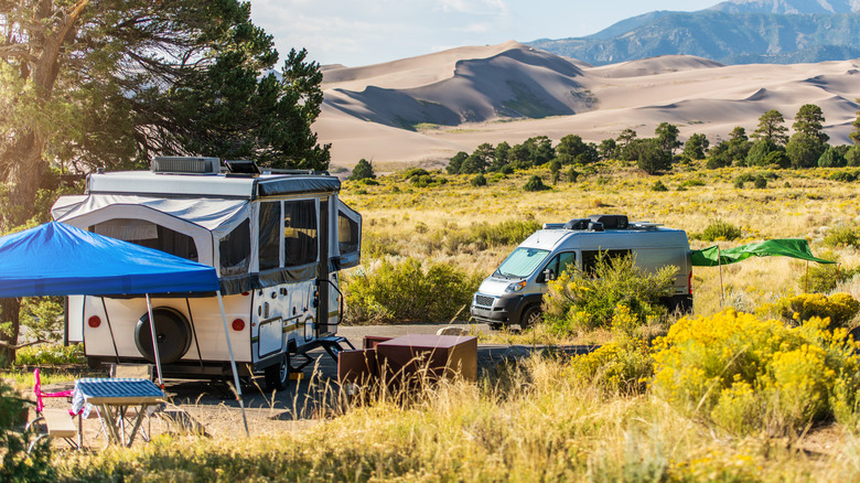 person with van and camper