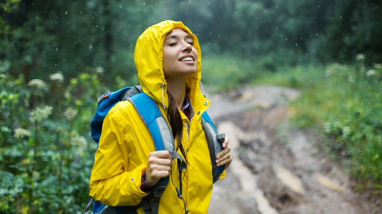 A hiker enjoying rainy weather