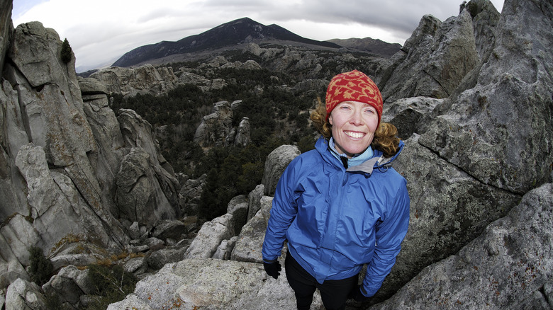 A woman beams a smile in City of Rocks, Idaho