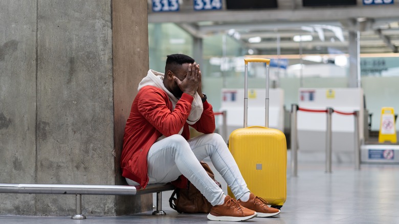 stressed man in airport