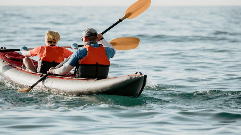 man and woman kayaking