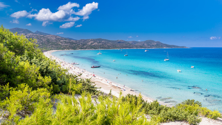scenic view of French beach and coastline with mountains