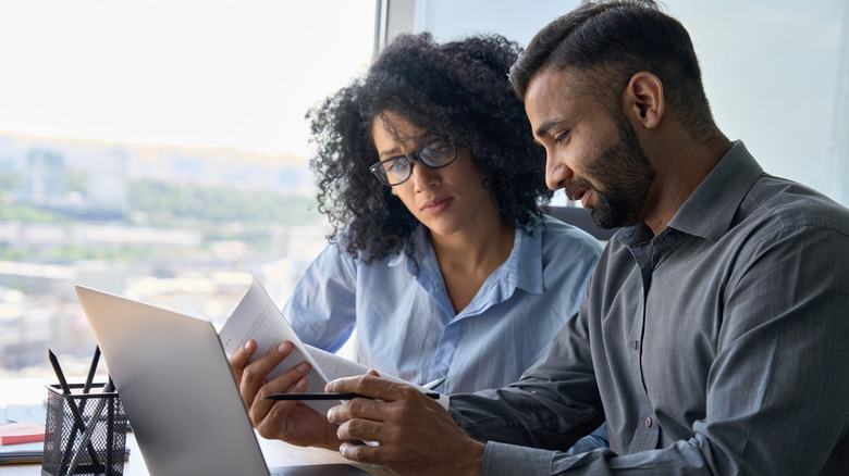 two people doing finances