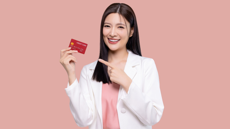 woman holding credit card