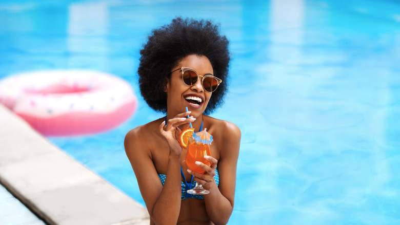 woman in pool at resort