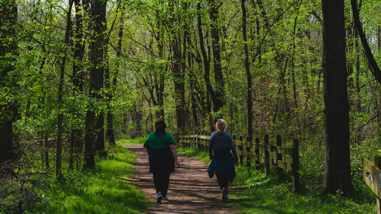 Two ladies walk down a trail in Goshen