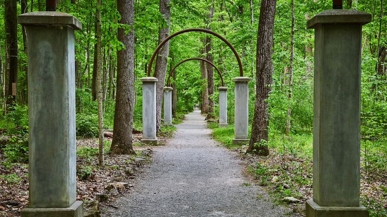Row of concrete pillars and metal arches, Rose Island