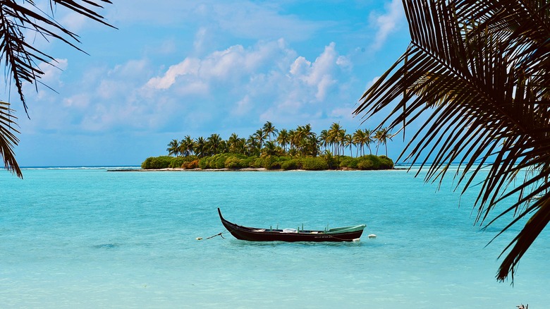 Boat floating in front of Kalpeni Island, Lakshadweep