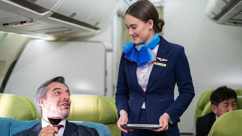 Flight attendant taking order