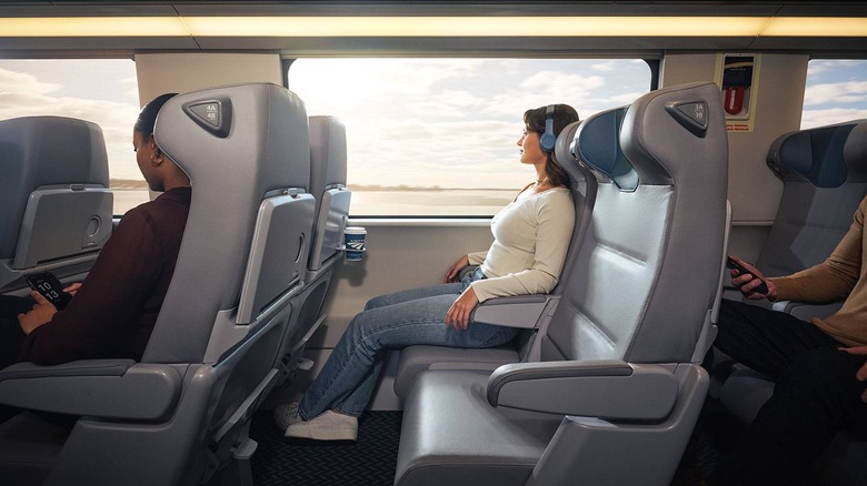 Woman on train wearing headphones