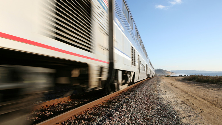 close up of train moving fast on tracks