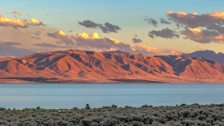 Utah lake and red mountains in the distance