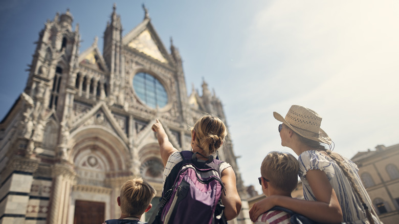 family looking at cathedral
