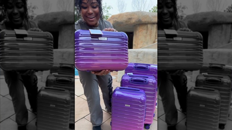 A creator on TikTok shows off her purple UUH luggage
