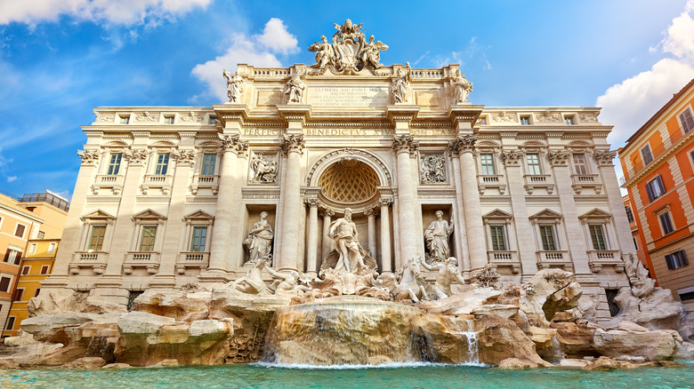 The Trevi fountain under a blue sky in Rome